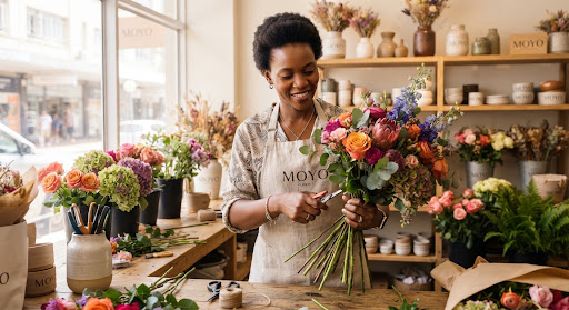 A florist preparing a bouquet